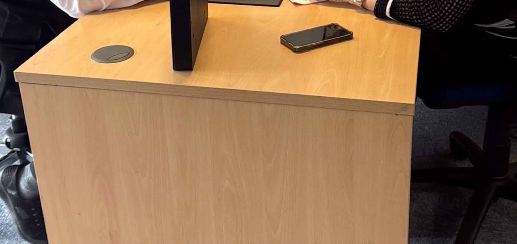 Close-up of an office desk during a consultation